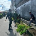 Wujud Kemanunggalan TNI - Rakyat, Kodim 1310/Bitung dan Yonif TP 916/BS bersama Warga Gelar Karya Bakti Pembersihan Kompleks Kanopi Bitung